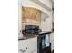 Close-up of the kitchen range with tiled backsplash and granite countertops at 3397 E Derringer Way, Gilbert, AZ 85297