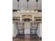 Classic kitchen with granite countertops, decorative backsplash, and seating at the island at 3397 E Derringer Way, Gilbert, AZ 85297