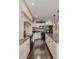 Spacious kitchen with granite countertops, stainless steel appliances, and wood flooring at 3397 E Derringer Way, Gilbert, AZ 85297