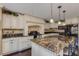 Spacious kitchen featuring granite counters, black appliances, and ample cabinet space at 3397 E Derringer Way, Gilbert, AZ 85297