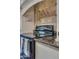 Close-up of the kitchen range with tiled backsplash and granite countertops at 3397 E Derringer Way, Gilbert, AZ 85297