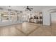 Spacious living room boasts stylish tile flooring and flows into an open kitchen and dining area at 3397 E Derringer Way, Gilbert, AZ 85297