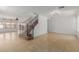 Bright living area showcasing tile floors and staircase with decorative wrought iron railing at 3397 E Derringer Way, Gilbert, AZ 85297