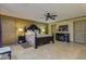 Spacious main bedroom with a ceiling fan and neutral colored tile flooring at 3397 E Derringer Way, Gilbert, AZ 85297
