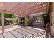 Covered patio area with shade structure and landscaped surroundings at 3397 E Derringer Way, Gilbert, AZ 85297