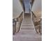 Carpeted staircase with decorative metal railings leading to the upper level at 3397 E Derringer Way, Gilbert, AZ 85297