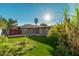 Lush backyard featuring a well-maintained lawn and mature landscaping, perfect for outdoor enjoyment at 346 E Highland Ave, Phoenix, AZ 85012
