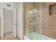 Modern tiled shower and glass door for bathing at 346 E Highland Ave, Phoenix, AZ 85012