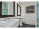 Bathroom featuring dual sinks, vanity, and tiled floor at 346 E Highland Ave, Phoenix, AZ 85012