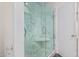 Bathroom showcasing the glass-enclosed shower with a white marble interior at 346 E Highland Ave, Phoenix, AZ 85012