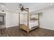 Well-lit bedroom with wood-look floors, ceiling fan, and window at 346 E Highland Ave, Phoenix, AZ 85012