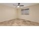 Bedroom featuring tile floors, ceiling fan, and natural light at 346 E Highland Ave, Phoenix, AZ 85012