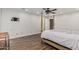 Bedroom featuring hardwood floors, ceiling fan, and closet access at 346 E Highland Ave, Phoenix, AZ 85012