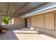 Inviting covered patio with textured stone accents and a charming outdoor ambiance for relaxation at 346 E Highland Ave, Phoenix, AZ 85012