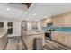 Open kitchen featuring marble countertops, stainless steel appliances, and hardwood floors at 346 E Highland Ave, Phoenix, AZ 85012