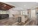 Open concept kitchen with marble countertops, stainless steel appliances, and hardwood floors at 346 E Highland Ave, Phoenix, AZ 85012