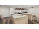 Spacious kitchen with large island, marble countertops, and stainless steel appliances at 346 E Highland Ave, Phoenix, AZ 85012