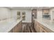 Bright kitchen showcasing marble countertops, stainless steel appliances, and an exterior door at 346 E Highland Ave, Phoenix, AZ 85012