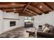 Cozy living room boasting a fireplace, window view, and hardwood floors at 346 E Highland Ave, Phoenix, AZ 85012