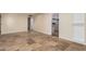 Neutral living room with tile floors and access to the kitchen at 346 E Highland Ave, Phoenix, AZ 85012