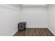 Walk-in closet featuring wood-look flooring and a built-in safe at 346 E Highland Ave, Phoenix, AZ 85012