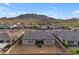 Aerial view of a well-located home nestled in a community with scenic mountain views and desert landscape at 3502 E Hazeltine Way, Queen Creek, AZ 85142