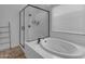 Bright bathroom with a large soaking tub and glass shower, showcasing a relaxing and modern design at 3502 E Hazeltine Way, Queen Creek, AZ 85142