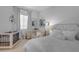 Bright bedroom with a crib, a dresser, and a comfortable seating area, creating a serene atmosphere at 3502 E Hazeltine Way, Queen Creek, AZ 85142