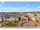 Beautiful home with manicured landscaping, paver driveway, and a well-maintained lawn, offering great curb appeal at 3502 E Hazeltine Way, Queen Creek, AZ 85142