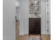 Cozy hallway features a lovely display of Gathering photos and a decorative dresser at 3502 E Hazeltine Way, Queen Creek, AZ 85142