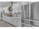 A modern kitchen featuring white cabinets, stainless steel appliances, and a gas cooktop at 3502 E Hazeltine Way, Queen Creek, AZ 85142
