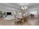 Open-concept layout showcasing a dining area, a piano and a bright living room, creating an inviting atmosphere at 3502 E Hazeltine Way, Queen Creek, AZ 85142