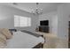 Comfortable bedroom with a large bed, dresser, and an abundance of natural light at 3502 E Hazeltine Way, Queen Creek, AZ 85142