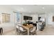 Eat-in kitchen with stainless steel appliances, modern cabinets, large island, and lots of natural light at 35540 N Breezy Ln, San Tan Valley, AZ 85140