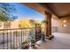 Balcony overlooking desert landscape, with desert plants and a view of other buildings at 36601 N Mule Train Rd # B14, Carefree, AZ 85377