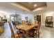 Open dining area with wood flooring, seamlessly connected to the living room, perfect for entertaining at 36601 N Mule Train Rd # B14, Carefree, AZ 85377