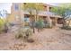 Exterior view of home with desert landscaping, plants, and trees at 36601 N Mule Train Rd # B14, Carefree, AZ 85377