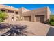 Inviting two-story home featuring a private entry and a spacious two-car garage at 36601 N Mule Train Rd # B14, Carefree, AZ 85377