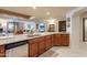 Open concept kitchen featuring granite countertops, stainless steel appliances, and wood cabinetry at 36601 N Mule Train Rd # B14, Carefree, AZ 85377