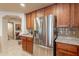 Modern kitchen featuring stainless steel appliances, granite countertops, and custom cabinets at 36601 N Mule Train Rd # B14, Carefree, AZ 85377