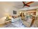 Inviting living room featuring an open floor plan into the kitchen and dining area at 36601 N Mule Train Rd # B14, Carefree, AZ 85377