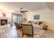Cozy living room with a fireplace, hardwood floors, ceiling fan and lots of natural light at 36601 N Mule Train Rd # B14, Carefree, AZ 85377