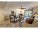 Inviting living room showcasing a fireplace, comfortable seating, and natural light through sliding glass doors at 36601 N Mule Train Rd # B14, Carefree, AZ 85377