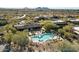 Overhead shot of a community pool with desert landscaping around it, in an oasis-like setting at 36601 N Mule Train Rd # B14, Carefree, AZ 85377