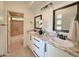 Bright bathroom with double sinks, granite counters, and a separate tub/shower at 3811 N 64Th St, Scottsdale, AZ 85251
