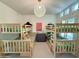 Bright bedroom featuring wooden bunk beds and a dark wood dresser with modern decor at 3811 N 64Th St, Scottsdale, AZ 85251