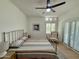Cozy bedroom with wood floors, shutters, ceiling fan, and queen bed at 3811 N 64Th St, Scottsdale, AZ 85251
