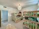 Bright bedroom featuring wooden bunk beds with plush bedding and a stylish woven light fixture at 3811 N 64Th St, Scottsdale, AZ 85251