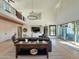 Open-concept living space with high ceilings, modern furnishings, and views of the outdoor patio at 3811 N 64Th St, Scottsdale, AZ 85251