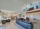Open-concept living space with high ceilings, a second-story loft, and a modern kitchen at 3811 N 64Th St, Scottsdale, AZ 85251